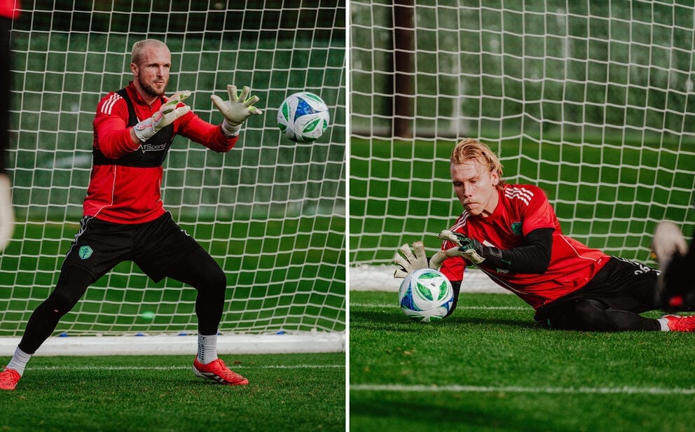 Two goalies in red block shots