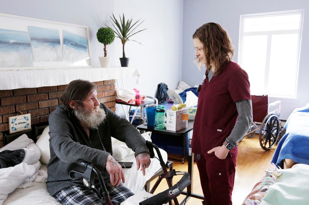 Providence Medical Group Nurse with medical respite shelter guest