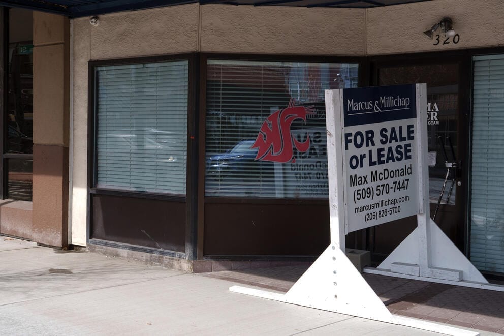 A sign advertising space for lease outside a closed business