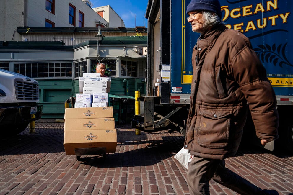 Troy Terry (left) delivers seafood