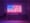 A light board on two wooden legs with red, white and blue LEDs making an American flag pattern