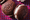 Chocolate whoopie pies on a crosshatched pink and purple background