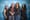 Four people stand together in front of a SIFF photo backdrop