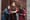 Photo of three actors in Shakespearean garb facing the camera from an outdoor stage.
