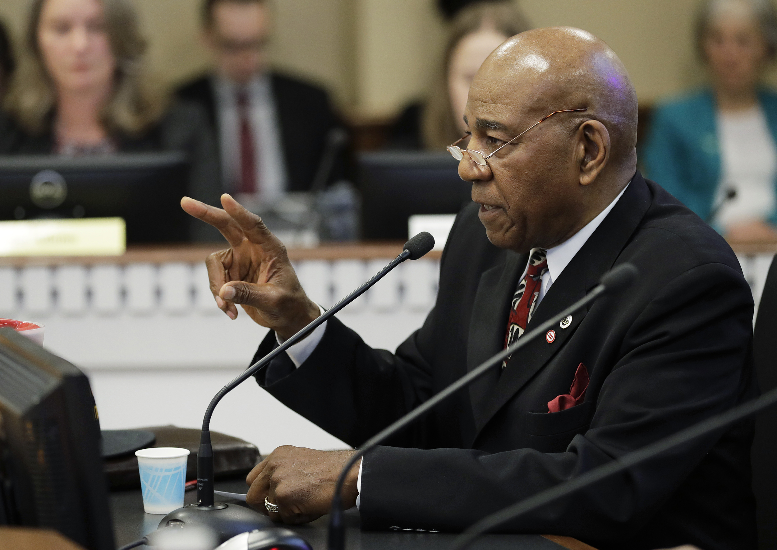 Nat Jackson speaks into a microphone