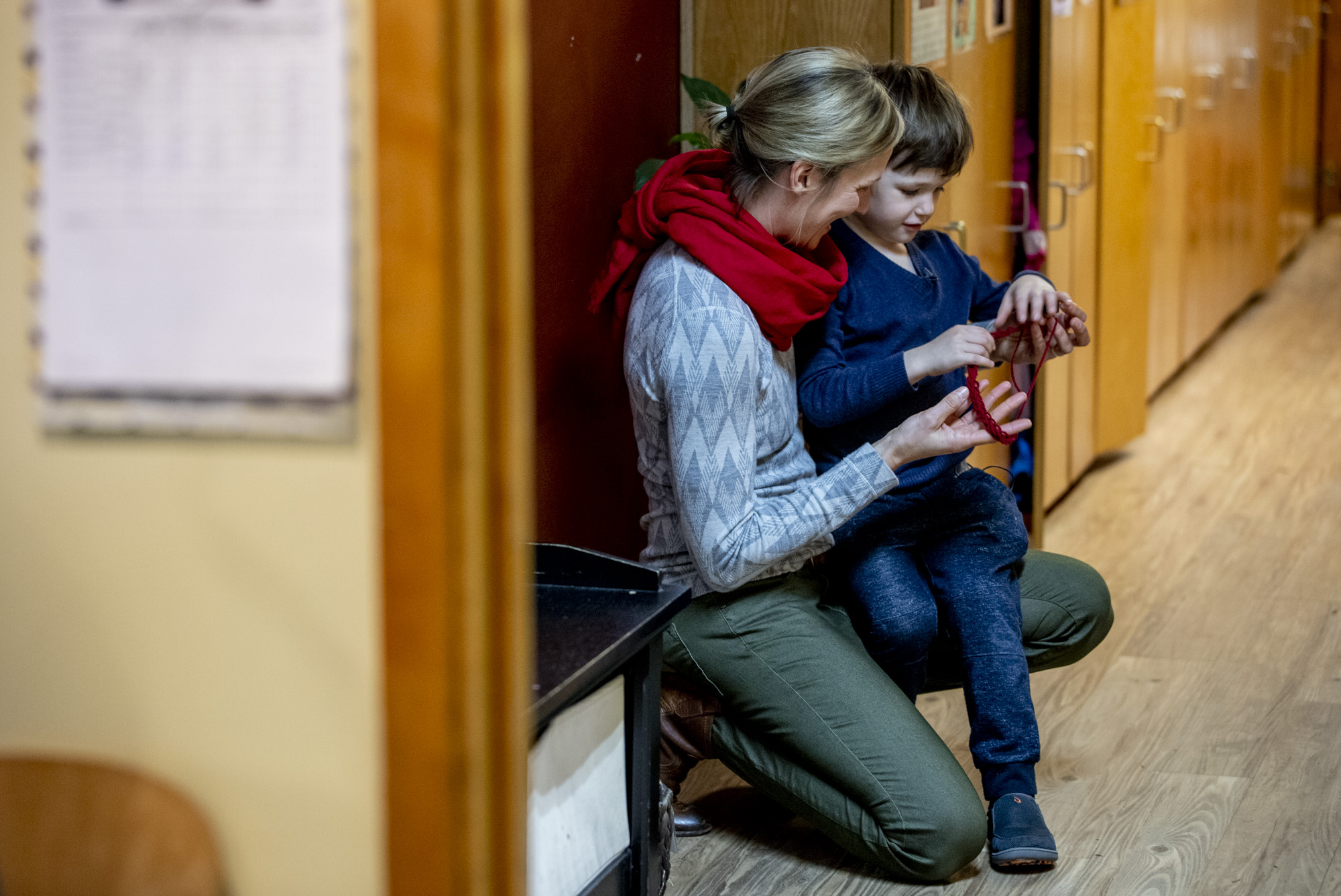 Jill and Hugo in the hallway at his school