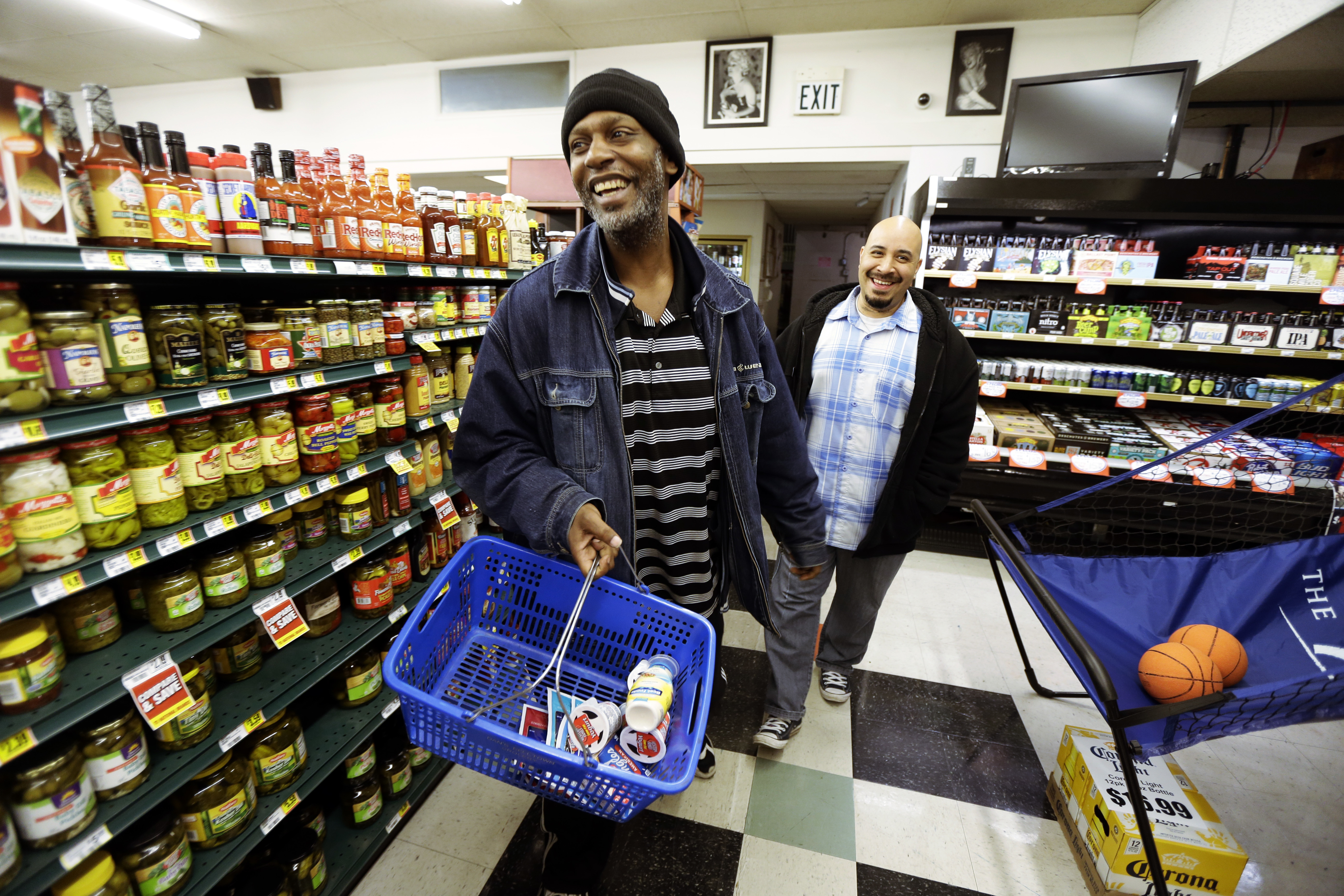 Man goes shopping in store with his caseworker