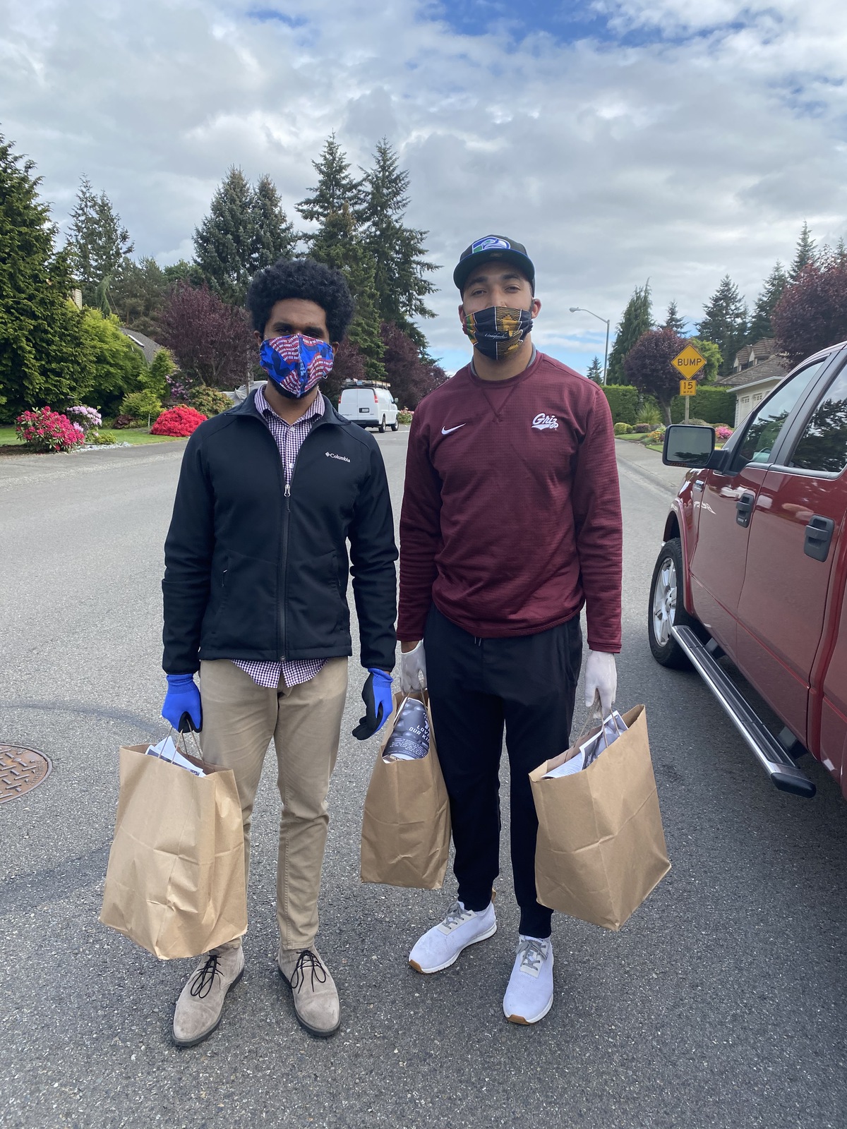 Jesse Johnson delivers food, while wearing a mask and gloves