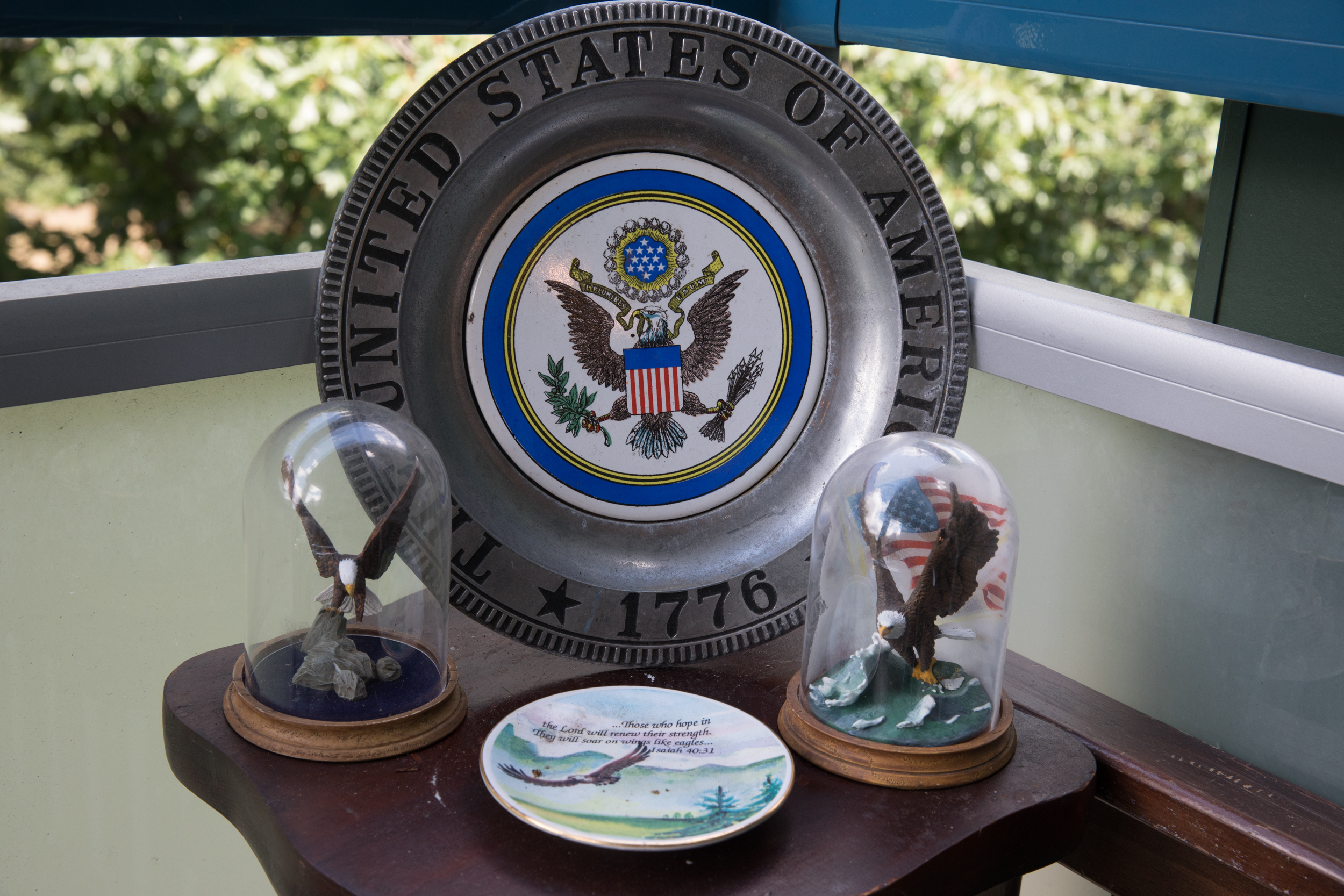 Patriotic mementos inside Benjamin Bourg's apartment at Compass Housing in Renton, July 11, 2018. (Matt M. McKnight/Crosscut)