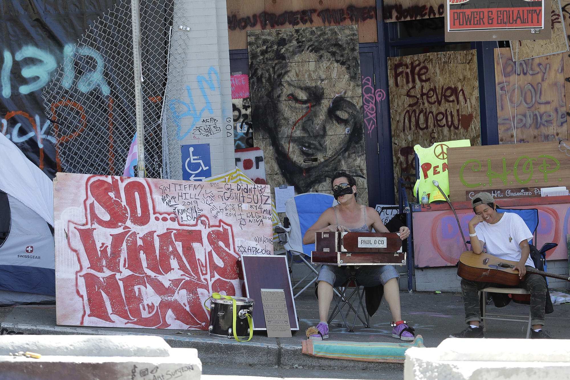 a painted face, looking forlorn, in CHOP