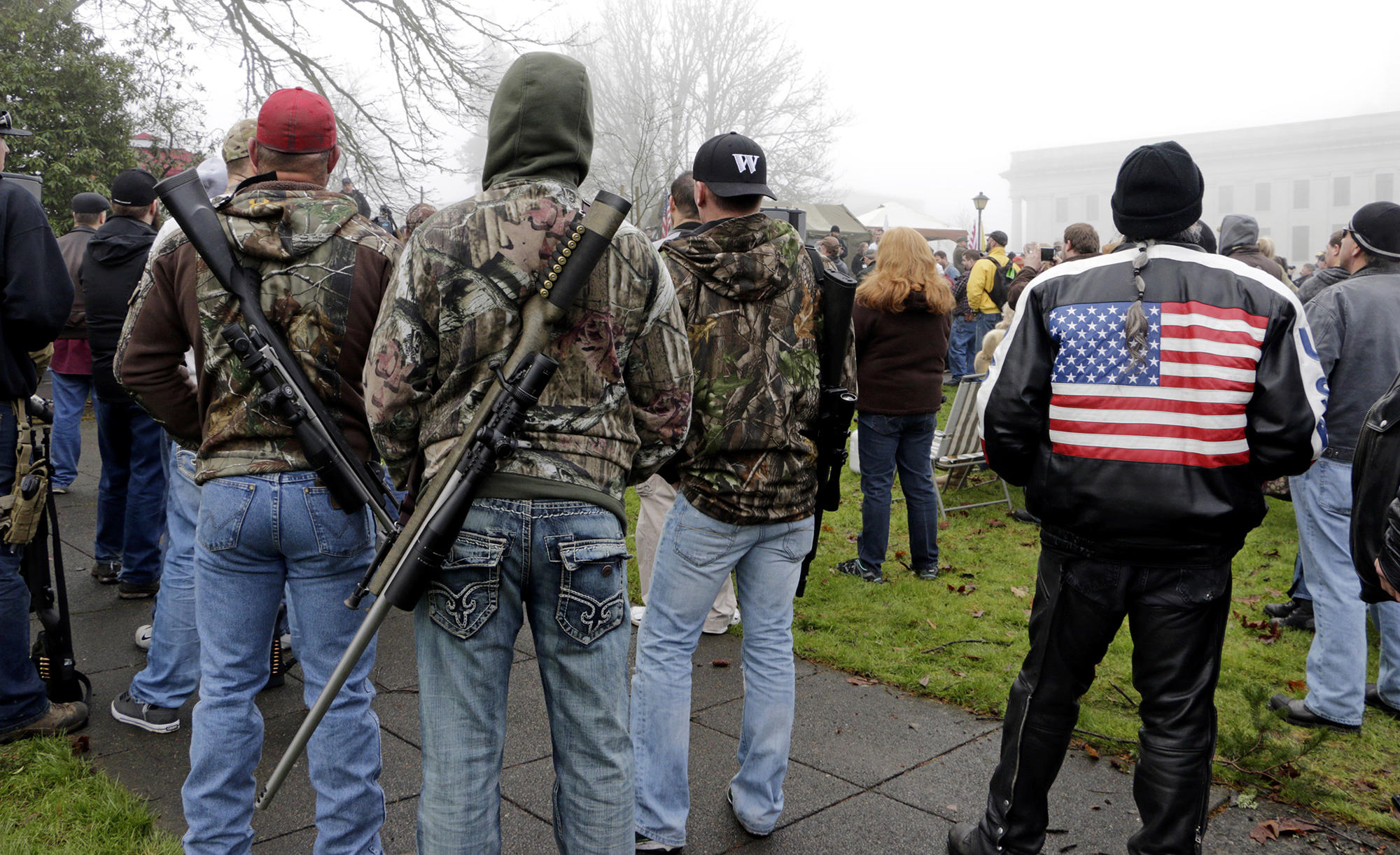 men with rifles slung over there shoulders