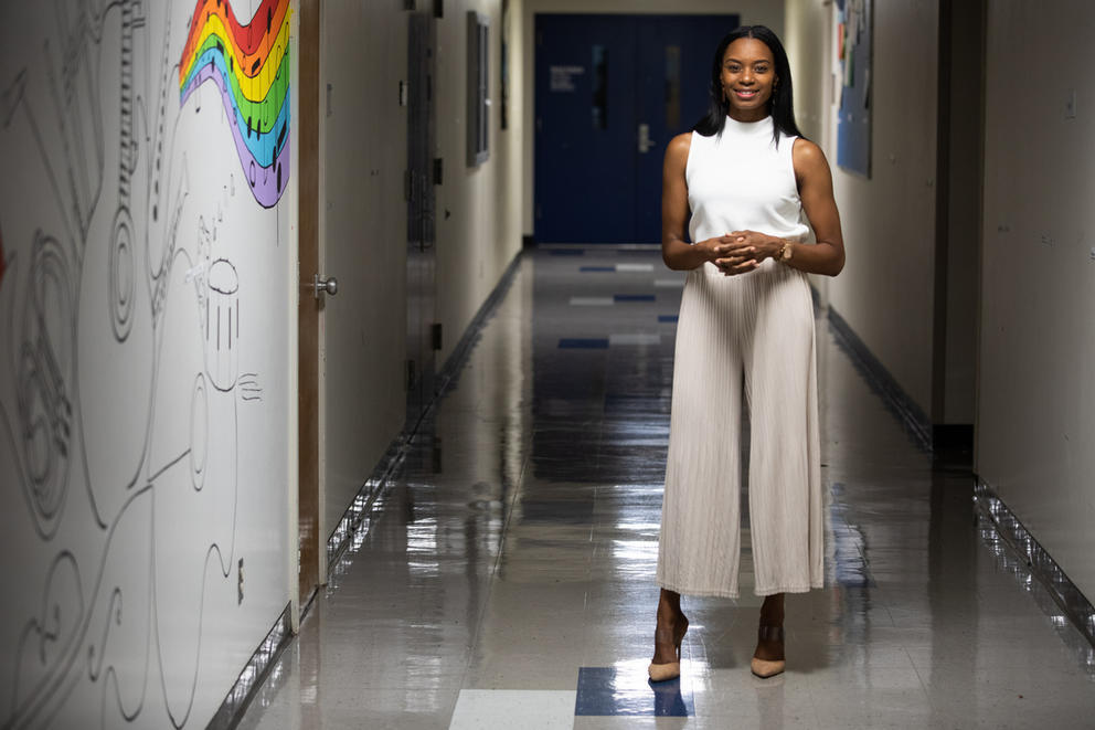 T'wina Nobles stands in a hallway