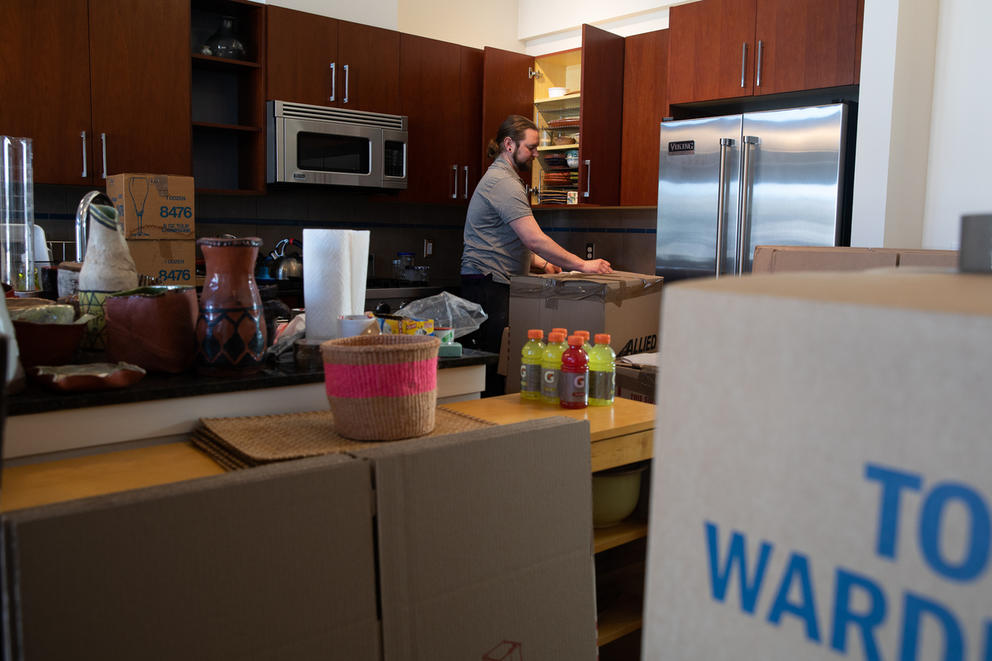 packing kitchen items into boxes