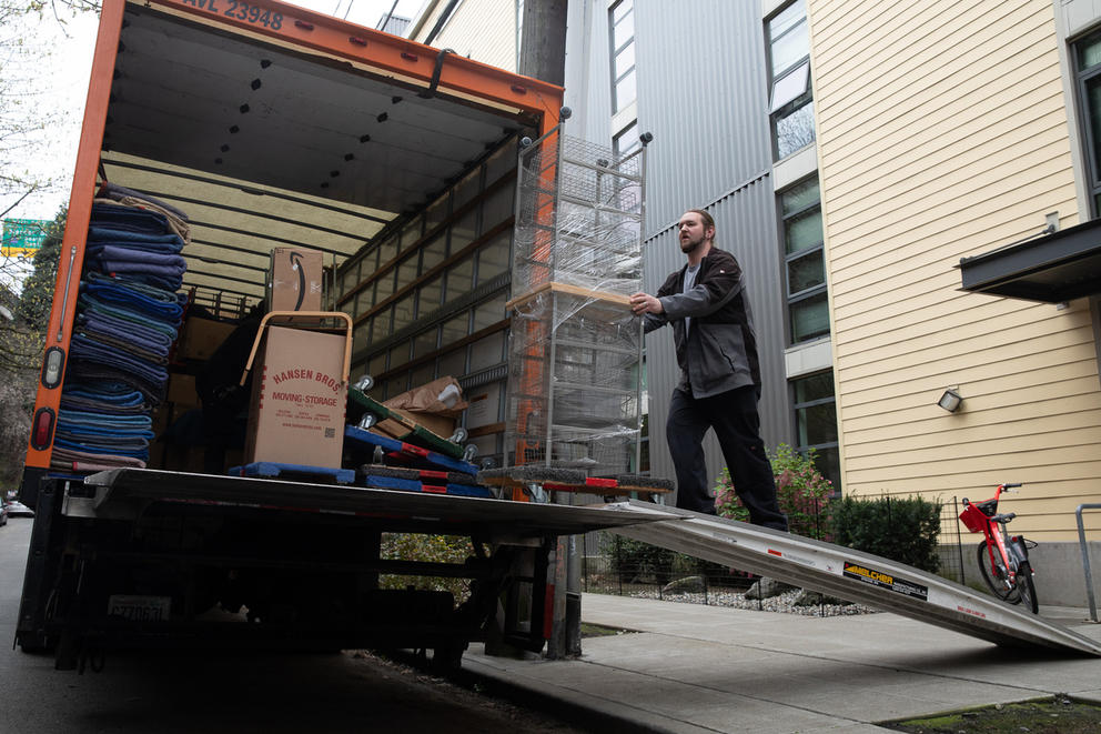 moving boxes into truck