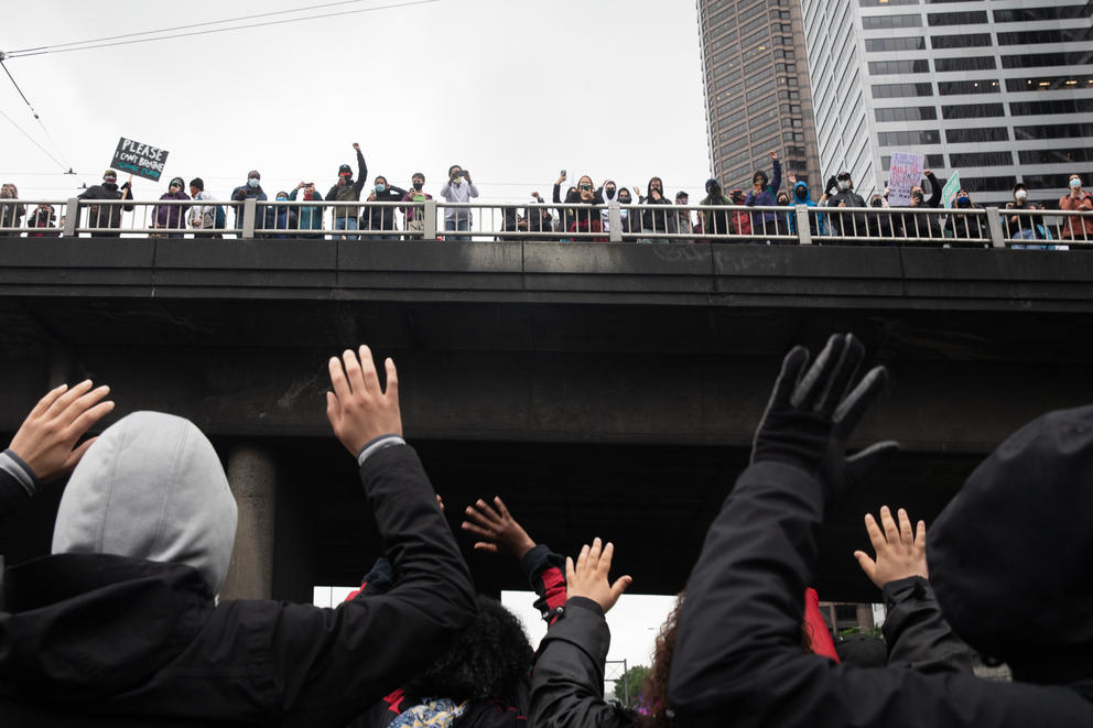 Supporters wave at protesters 