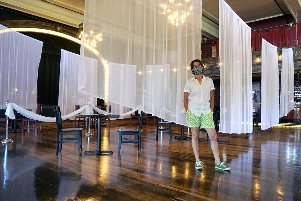 Kuperman stands in the ballroom turned socially distanced dining room.