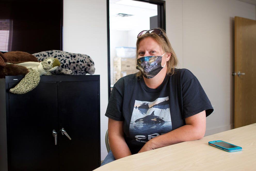 Casey Mclean, executive director of SR3 and a veterinary nurse, sits at the boardroom table in the main room of the organization's new modular hospital building