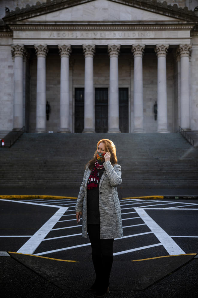 Kim Wyman stands in parking lot in front of Capitol building