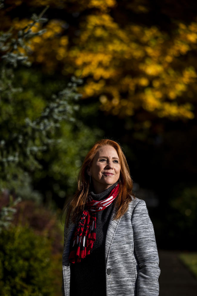 Kim Wyman in front of leaves changing colors