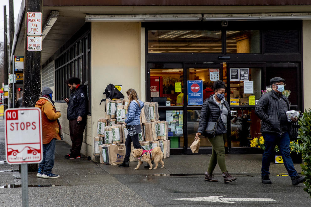 the bustling entrance of a grocery store