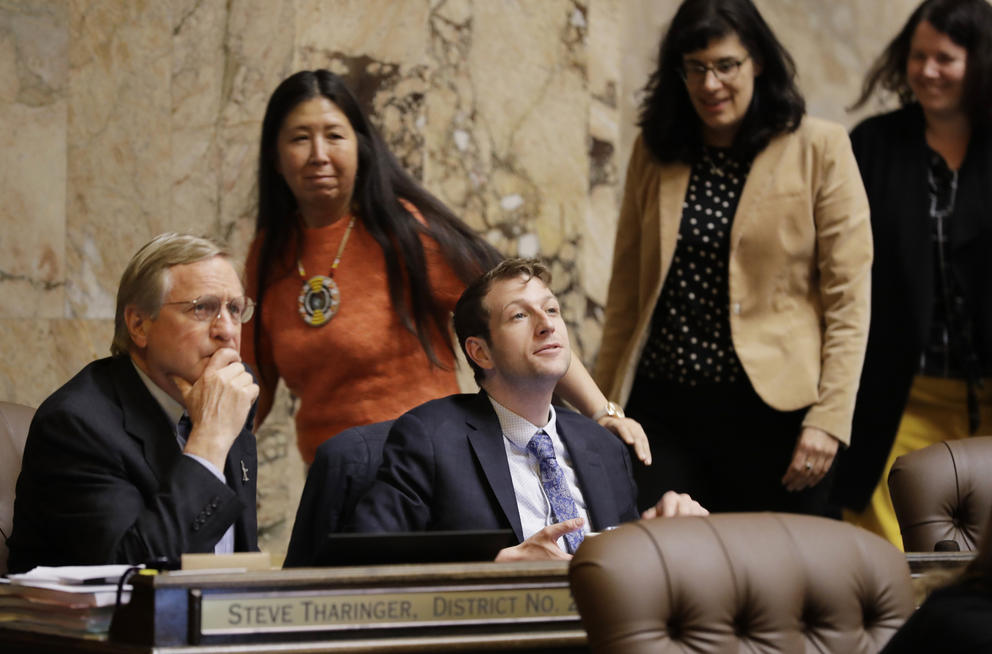 lawmakers on the floor of the Washington House