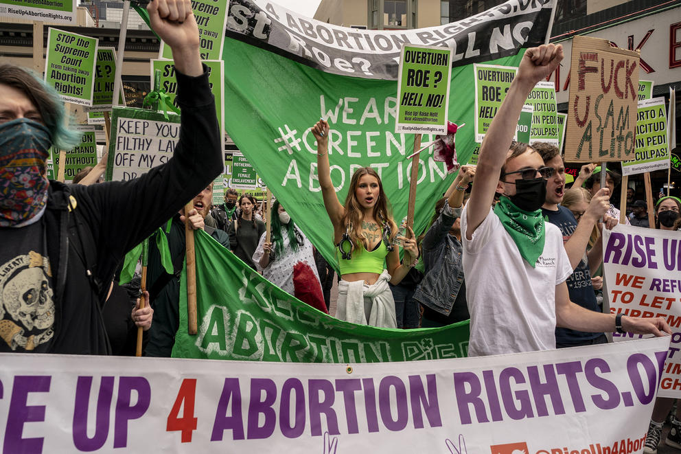 Demonstrators rally outside of Pike Place Market