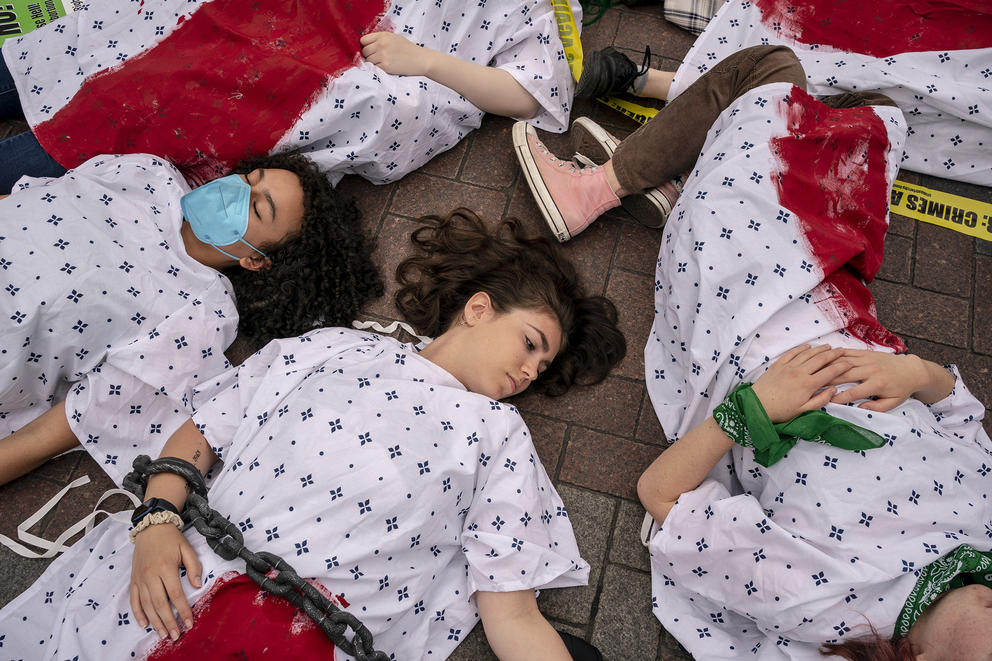 Demonstrators stage a “die in” on East Pine Street in downtown Seattle 