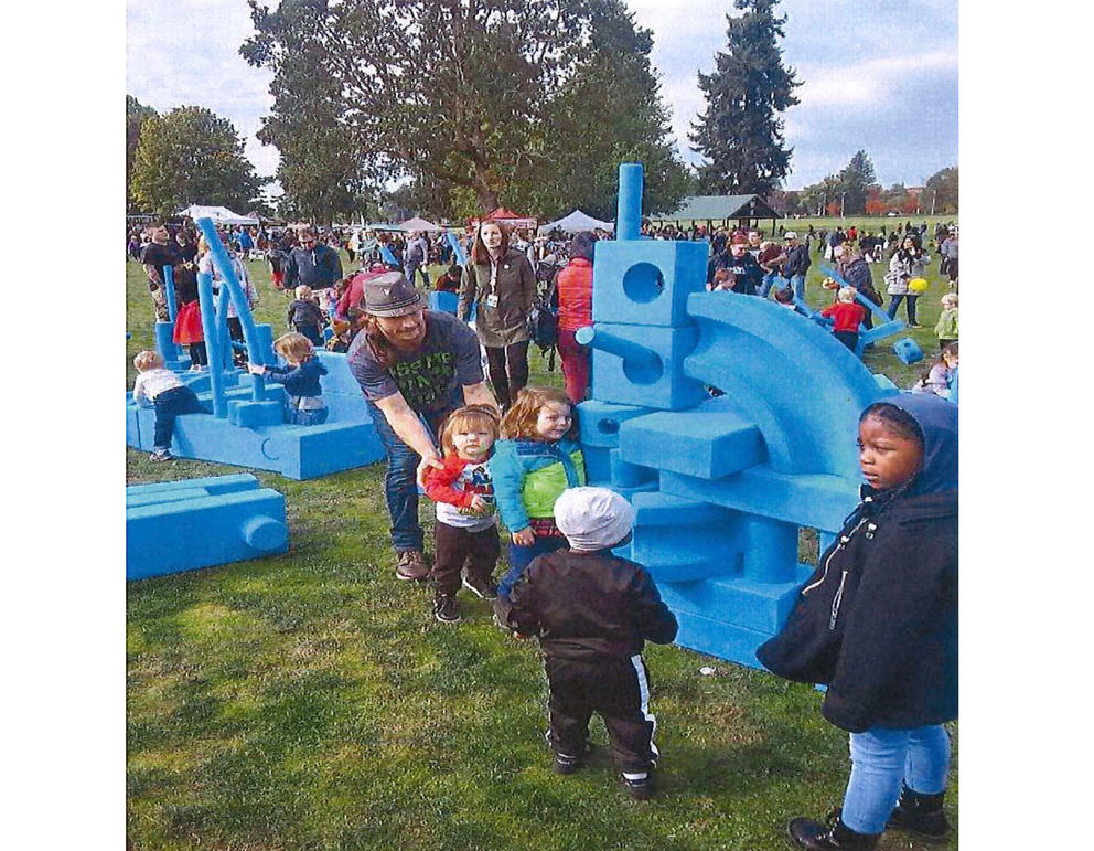 Children play on a mobile playground