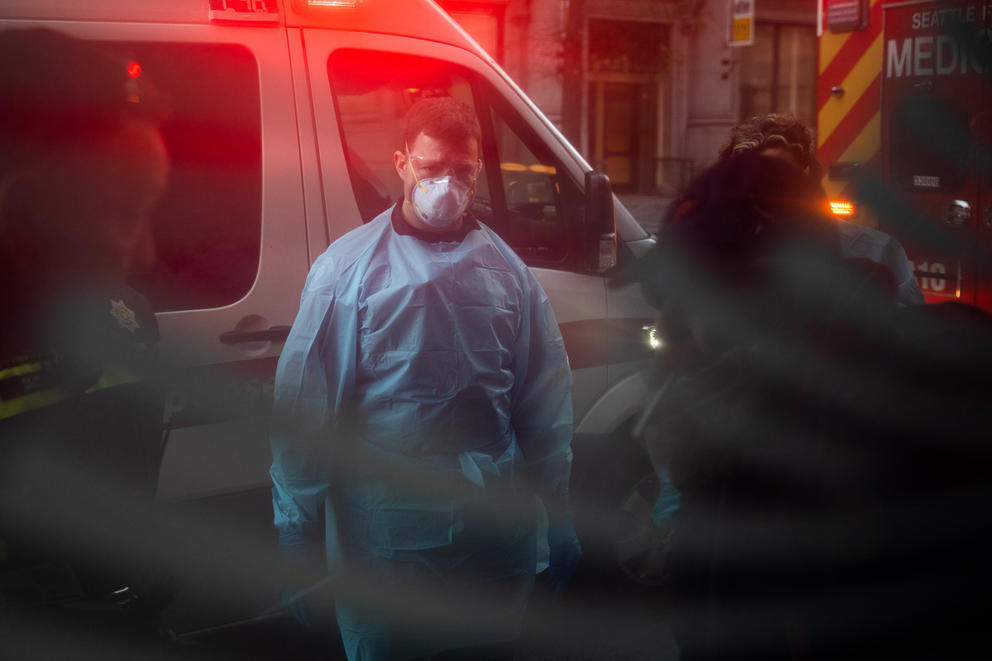 Seattle firefighter speaks with a patient.
