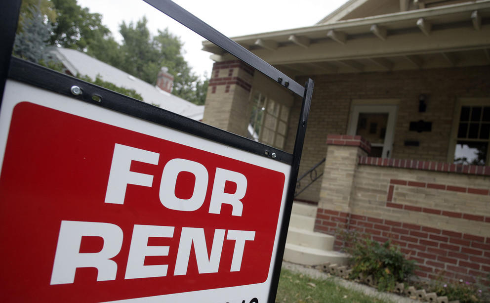 A "for rent" sign appears outside a property
