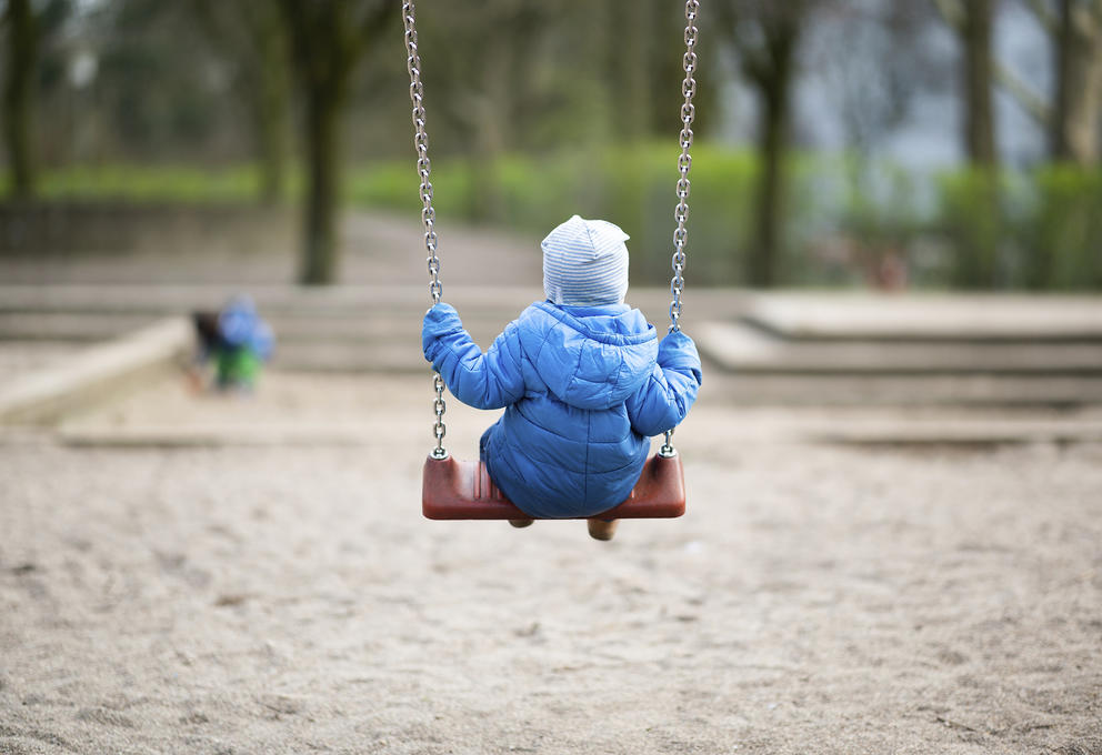 a little buddy on a swing