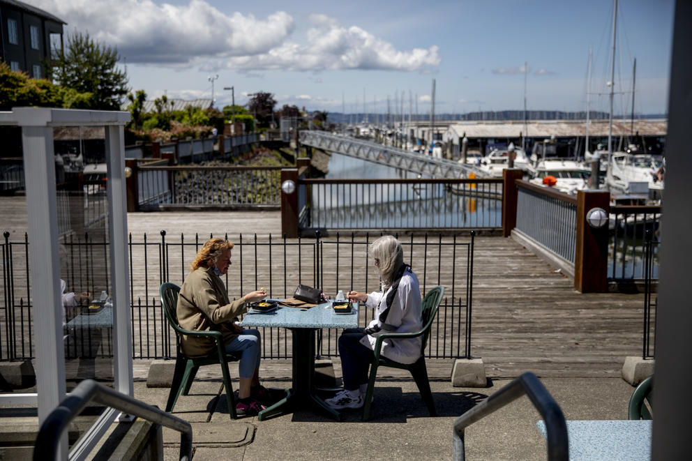 people sitting outside at a restaurant