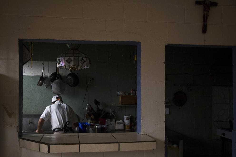 a man works in a kitchen