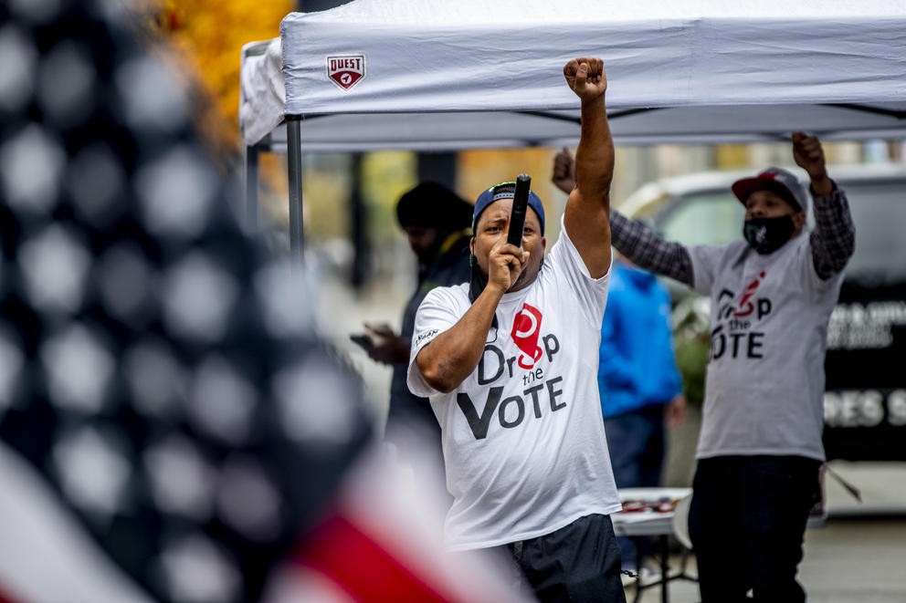 voters drop of ballots