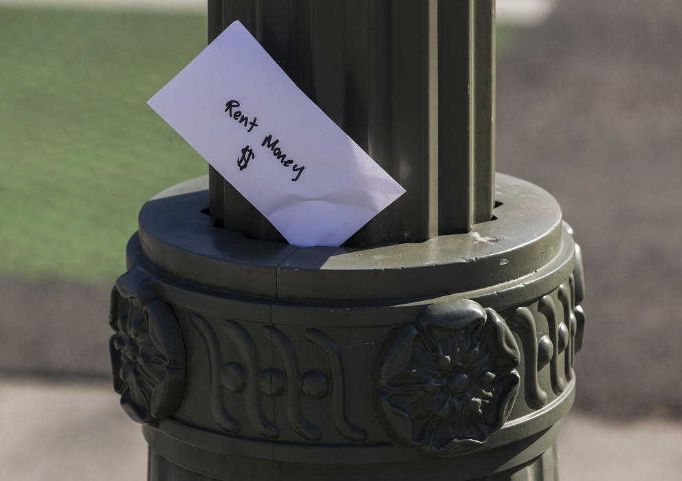 envelope that reads 'rent money'