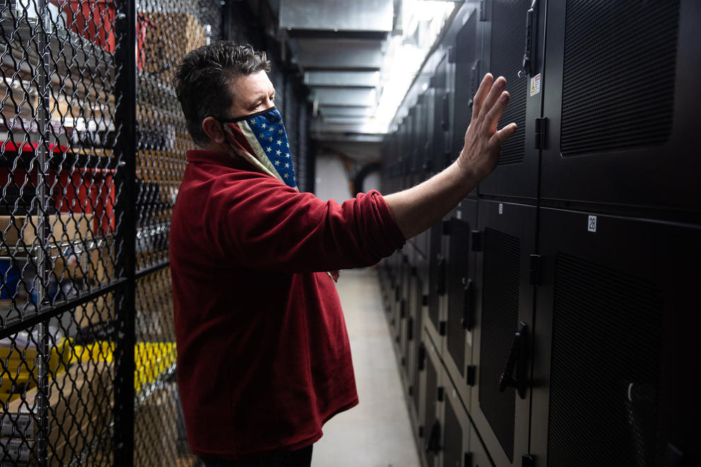 Man touches equipment in a room