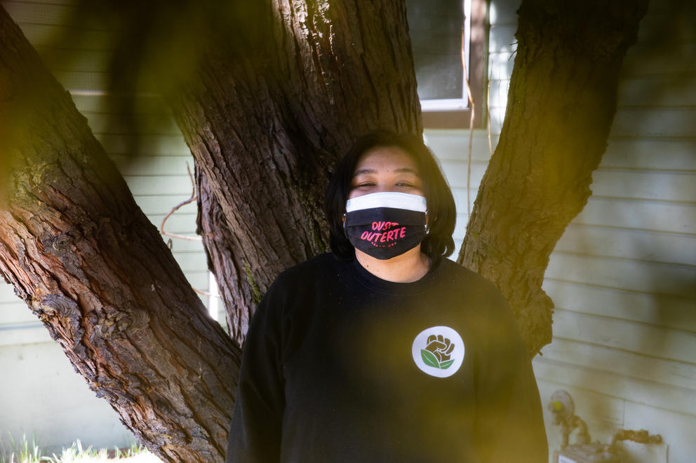 Person in front of tree