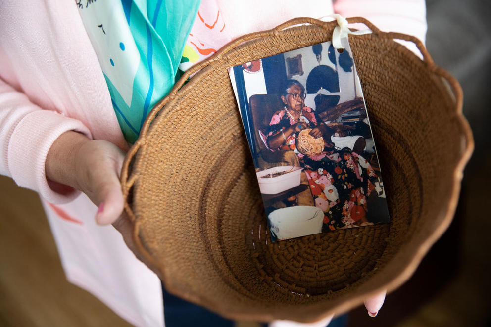 A woven basket with a photograph inside it