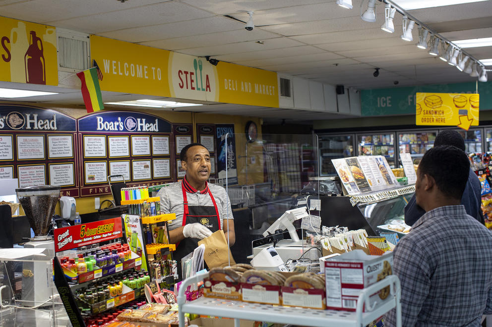 Shoppers wait at the counter
