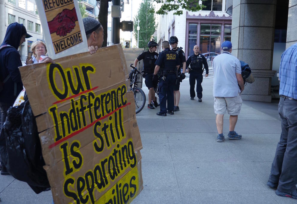 A sign set up during a protest in front of Immigration and Customs Enforcement’'s downtown Seattle location to denounce the separation of immigrant families, July 26, 2018. (Photo by Manola Secaira/Crosscut)