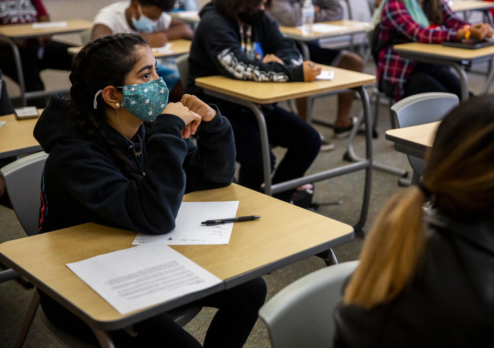 A student listens in a classroom