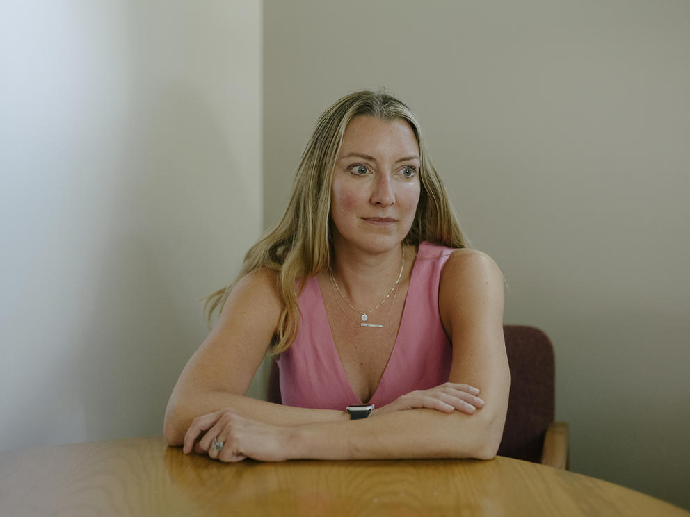 Woman sits at table