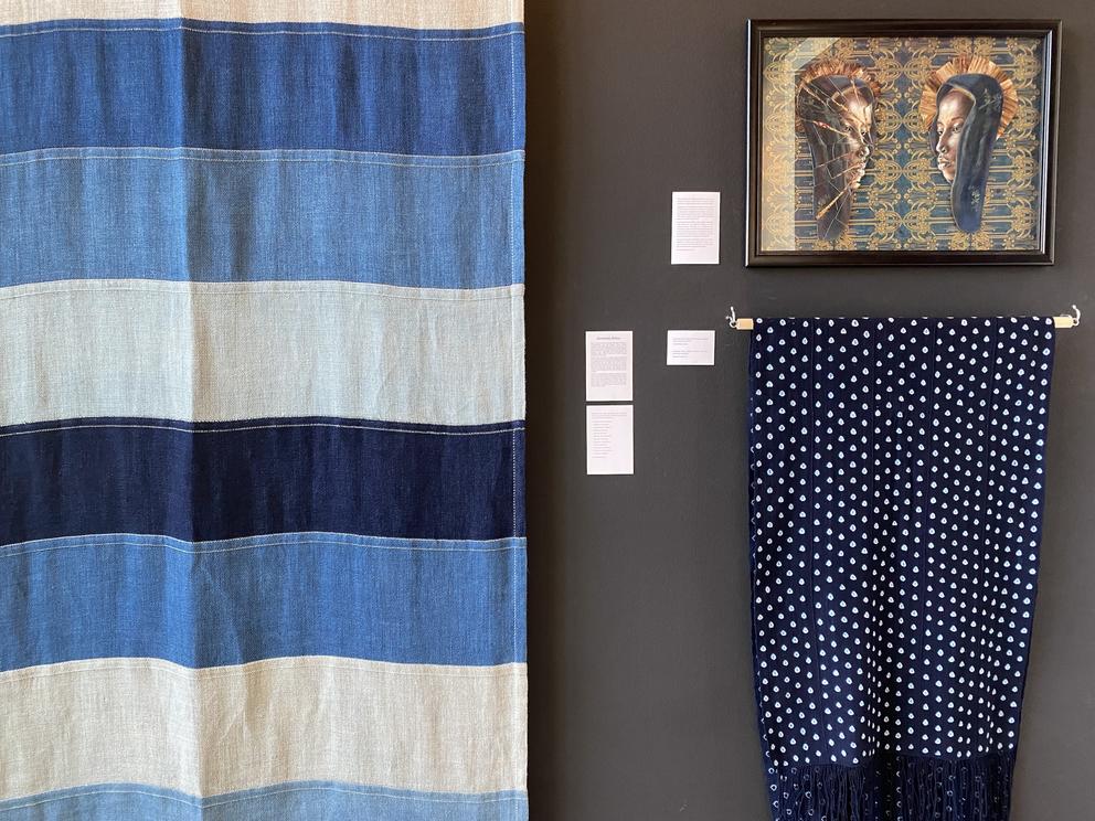 an installation shot of fabric art on a wall
