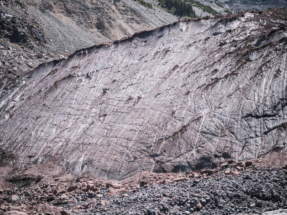 Rocks covering part of an icy slope