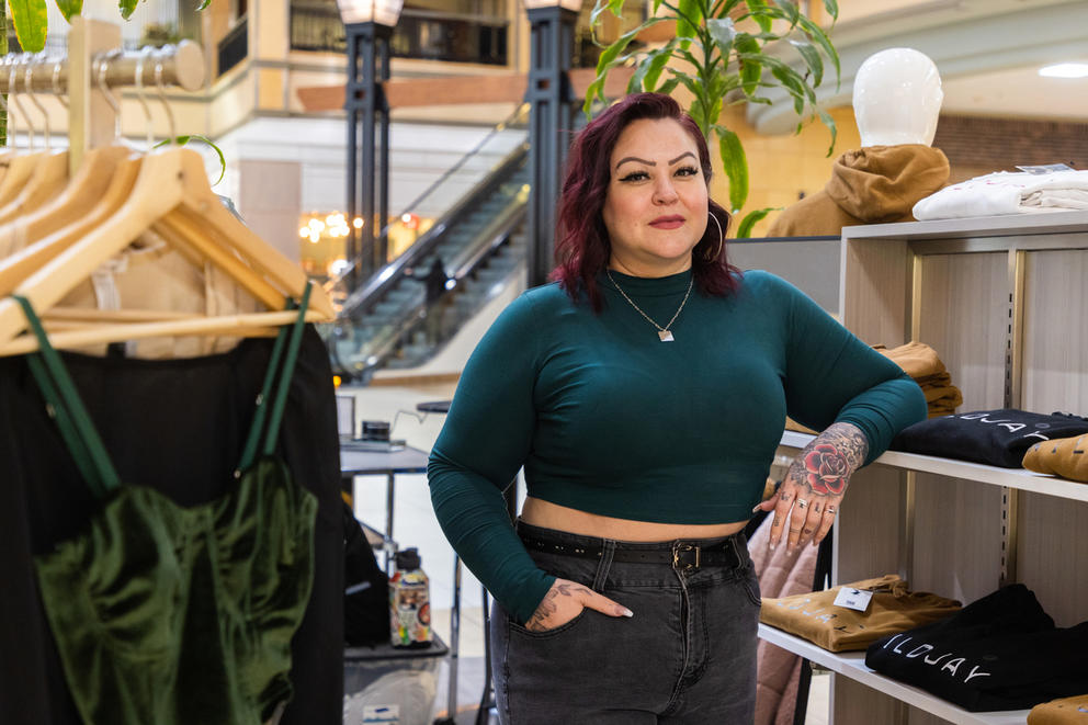 Wildjay owner stands in front of her shop