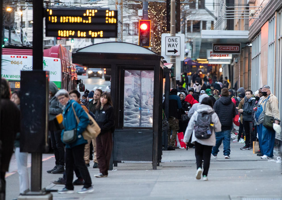 a crowded sidewalk in downtown seattle