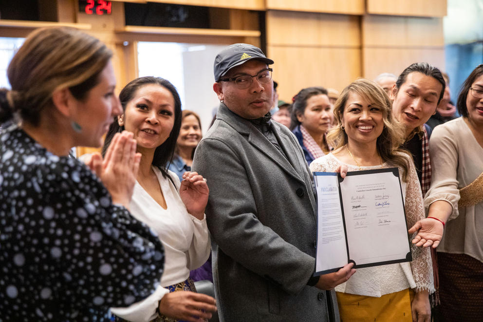 Sameth Mell and Savong Lam hold the proclamation