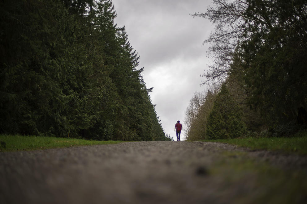 Nathan Lambrecht walks along a trail in Woodinville, Washington,