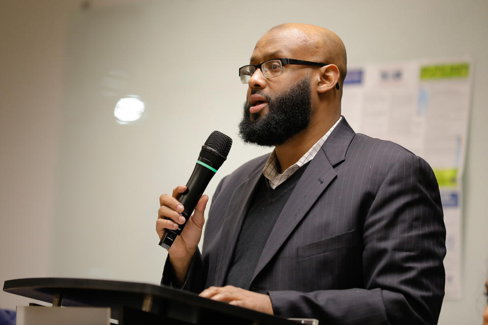 a man speaks into a microphone