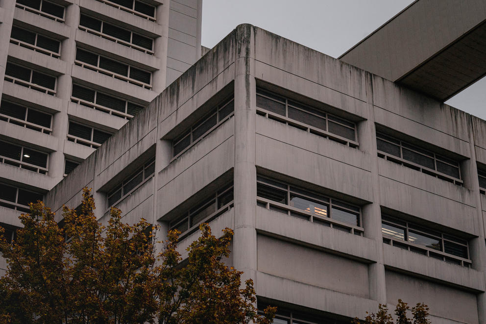 the corner of a gray jail building